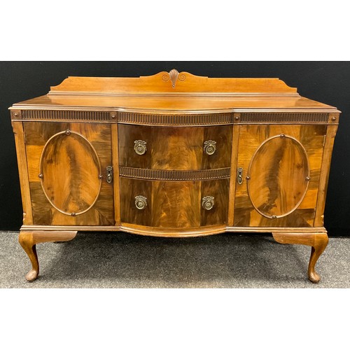 76 - A 19th century style reproduction walnut sideboard, shaped quarter galleried back, break-front centr... 