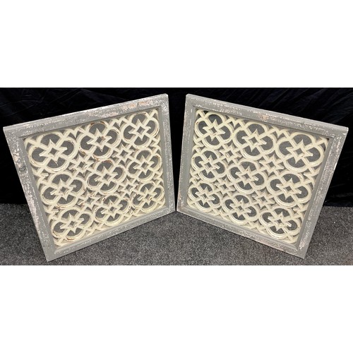 77 - A pair of Moroccan style fretwork garden mirrors, each measuring 65cm x 65cm, (2).