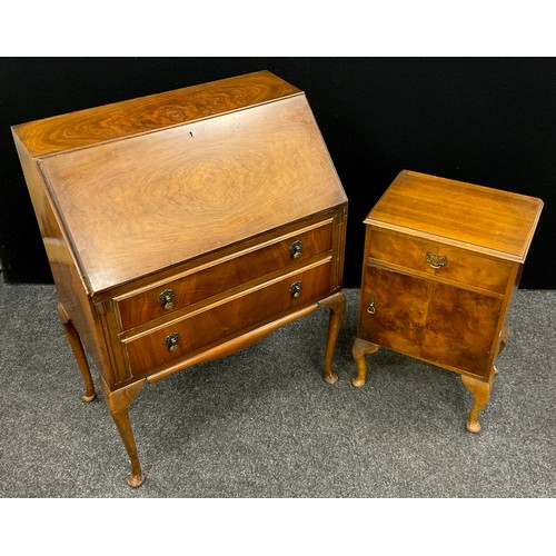 82 - A mid 20th century walnut bureau by L. Marcus Ltd., of London, 105cm high x 77cm wide x 45.5cm deep;... 