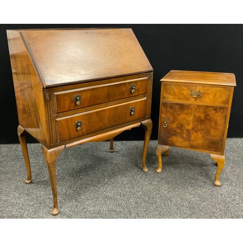 82 - A mid 20th century walnut bureau by L. Marcus Ltd., of London, 105cm high x 77cm wide x 45.5cm deep;... 