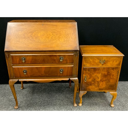 82 - A mid 20th century walnut bureau by L. Marcus Ltd., of London, 105cm high x 77cm wide x 45.5cm deep;... 