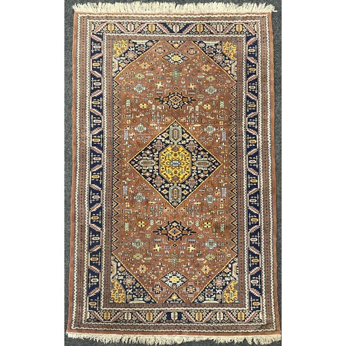 86 - A Middle Eastern Nain style rug, knotted with a central diamond shaped medallion within a field of s... 