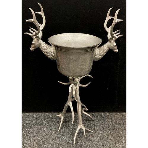 89 - A large silver coloured metal ‘Stag’s head’ wine cooler, raised on a Stag Antler form tripod base, 1... 