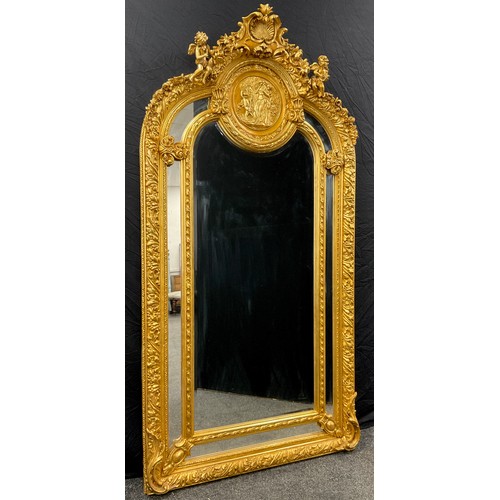 94 - An impressive Louis XIV style ‘Baroque’, arched, gilt-wood effect mirror, 213cm high x 109cm wide.