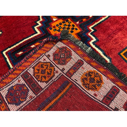 99 - A South West Persian Lori Rug / carpet, hand-knotted in rich tones of red, deep blue, orange, cream,... 