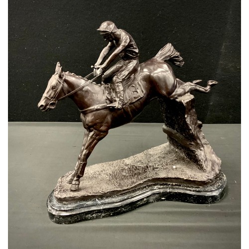 107 - A bronzed metal figure group of horse and jockey, mounted on metal plinth, 33cm high