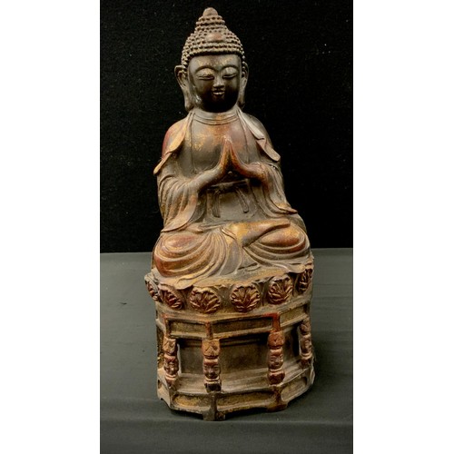 117 - A Chinese bronzed coloured metal figure of sitting buddha, 30cm high