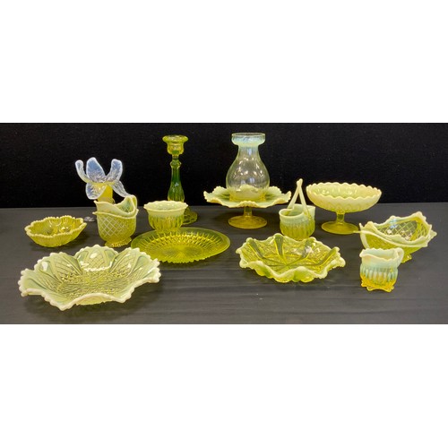 133 - A Victorian Uranium Vaseline glass posy vase,  footed comport, bowls, baskets, candlestick, strawber... 