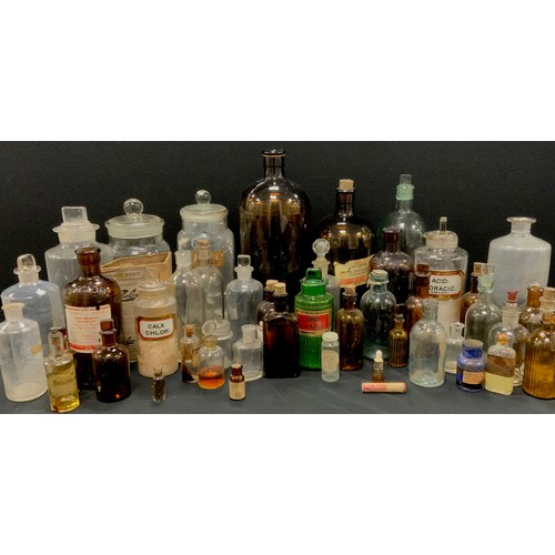 134 - 19th century and later apothecary bottles including clear jars, labeled jars, poison, Newsholme Ltd ... 