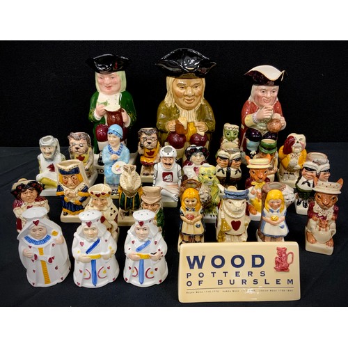 144 - A collection of Tony Wood studio pottery mini figures including different Alice in Wonderland charac... 