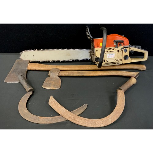 149 - A petrol MT-9999 chainsaw, two sickles, two axes (5)