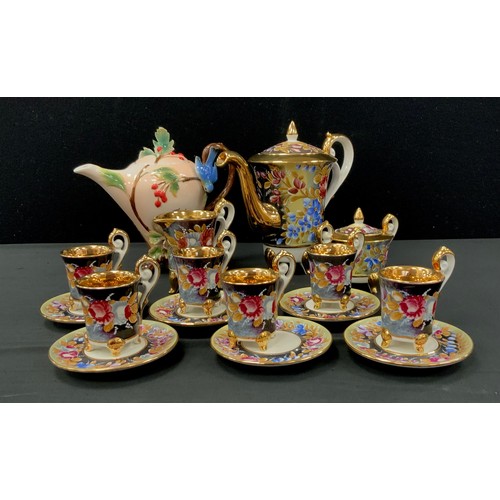 170 - A Capodimonte Italian porcelain Coffee set, for six, decorated with flowers on a black ground, inc c... 