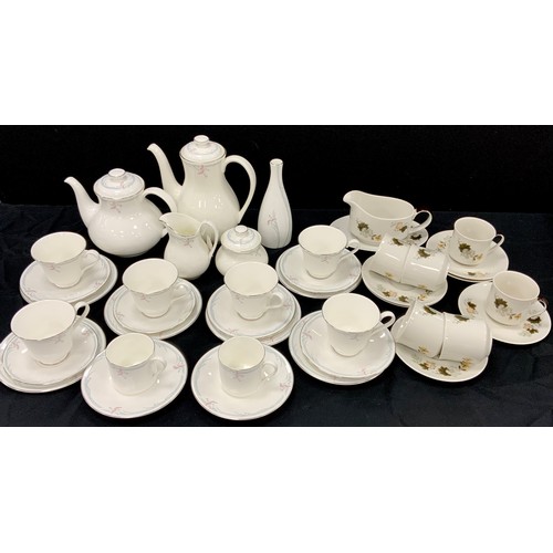 173 - A Royal Doulton Carnation pattern tea set, inc two teapots, sugar bowl, milk jug, cups, saucers etc;... 