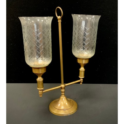 197 - A 20th century cut glass and brass two branch storm lamp style table lamp, 37cm high.