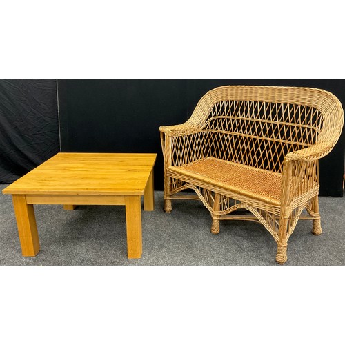 201 - A Cane and wickerwork conservatory sofa, 98cm high x 118cm wide x 54cm deep;  and a golden oak coffe... 