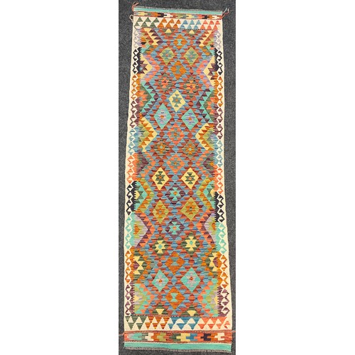 208 - A Turkish Anatolian Kilim rug, knotted with a traditional geometric design, in bright colours, blue,... 