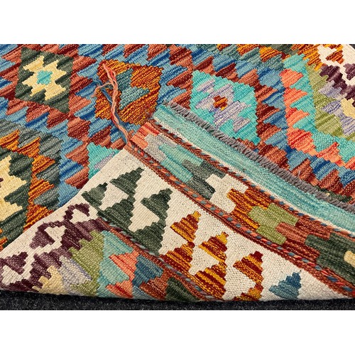 208 - A Turkish Anatolian Kilim rug, knotted with a traditional geometric design, in bright colours, blue,... 