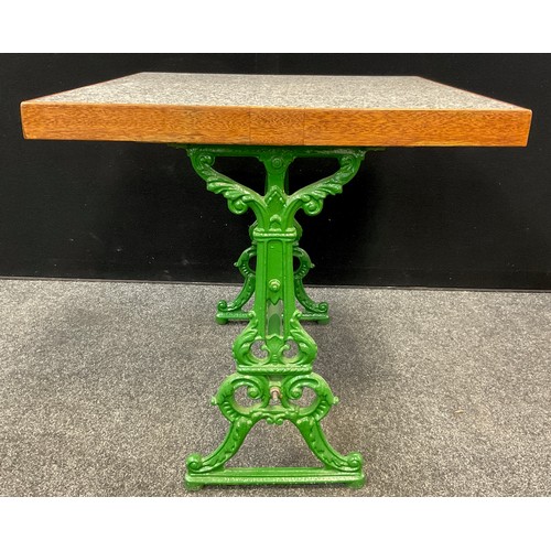 224 - A marble-top table, Coalbrookdale style cast iron base, painted green, 75cm high x 85cm x 78.5cm.