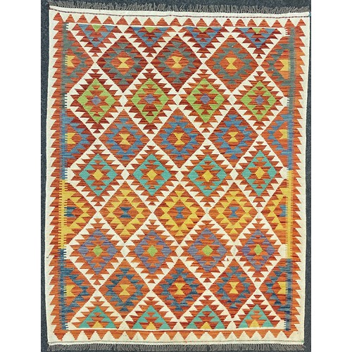 227 - A Turkish Anatolian Kilim rug, knotted with a traditional geometric design, in red, turquoise, blue,... 