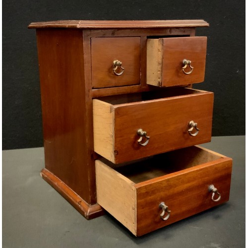 258 - Miniature Furniture - an early 20th century chest of two short and two long drawers