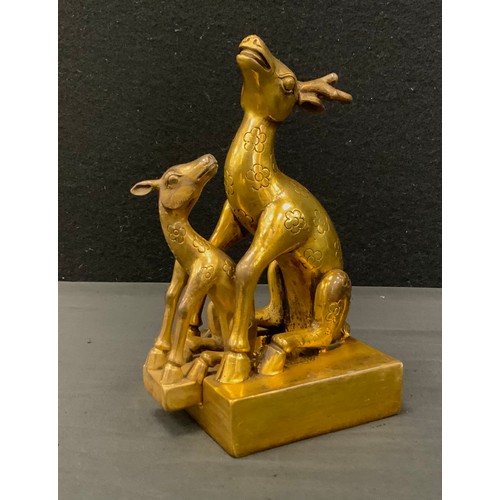 271 - A gilt bronzed metal Chinese model double deer seal, 19cm high