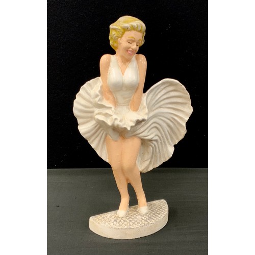 278 - A cast iron door porter of Marilyn Monroe, 34cm high