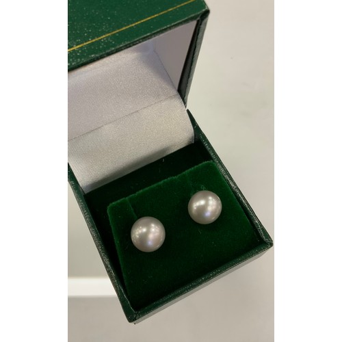 347 - A pair of grey cultured pearl earrings, 9ct gold mounts, Pillar fittings, 0.9cm diameter, 2,6g gross