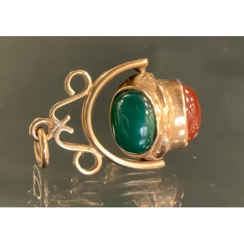 351 - A 9ct gold revolving three cabochon pendant, with carnelian, garnet and green cabochon panels, Sheff... 