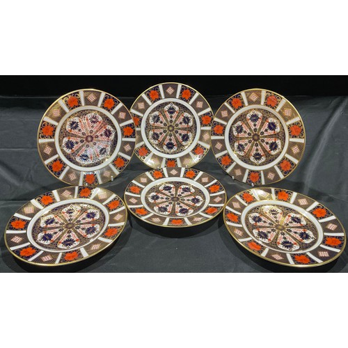 23 - A set of three Royal Crown Derby Imari 1128 pattern side plates, 21.5cm diameter, first quality; a s... 