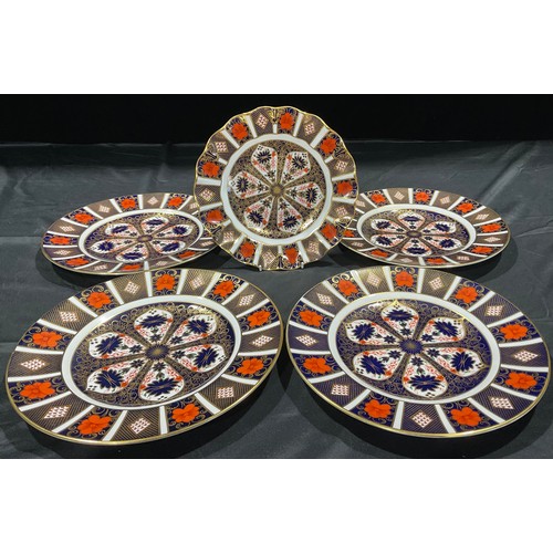 26 - A pair of Royal Crown Derby Imari 1128 pattern dinner plates, first quality, 27cm; two others, one f... 