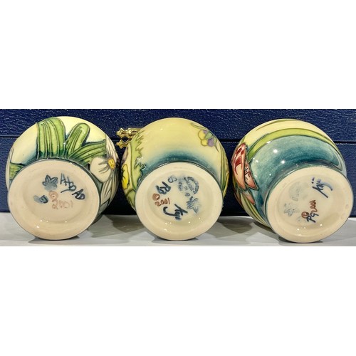 37 - A set of six Moorcroft miniature vases, tube lined, various patterns, lined presentation box.
