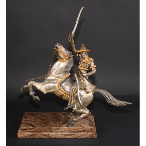 3363 - Continental School (20th century), a parcel-gilt and silvered bronze, of a cavalry officer on horseb... 