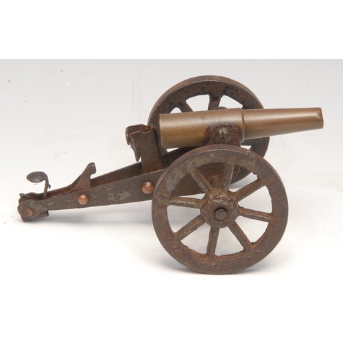 3219 - An early 20th century trench art model cannon, the barrel formed from a brass bullet casing, 13.5cm ... 