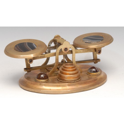 3169 - A set of Victorian gilt brass and banded agate letter balance postal scales, 17.5cm wide, c.1870