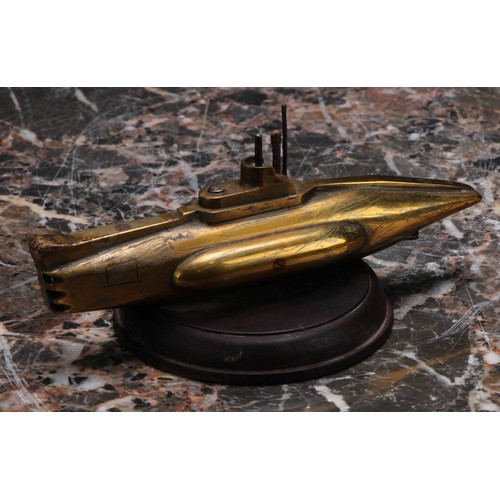 3220 - An early to mid 20th century brass desk weight, as a submarine, 15cm wide