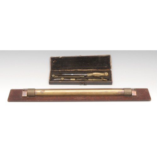 3379 - A World War II period brass and bakelite rolling rule, marked B7622 Astonmanda, 38cm long, dated 194... 