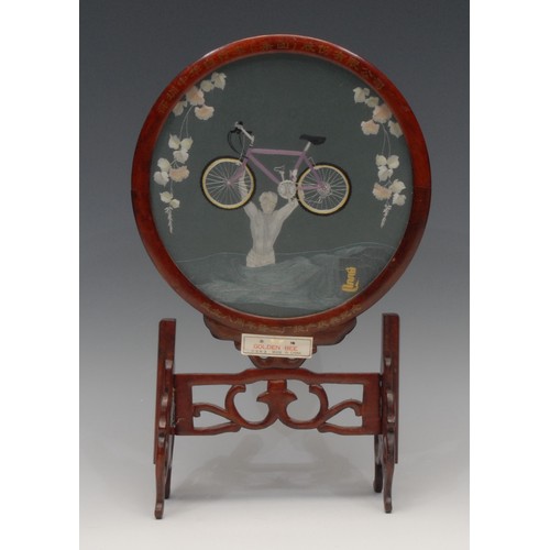 3070 - A Chinese hardwood table screen, the circular banner worked in coloured silks with a boy carrying hi... 