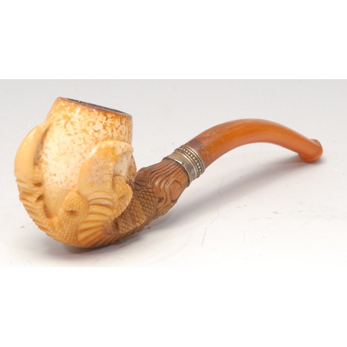 3108 - A German meerschaum pipe, carved as a dragon's claws, 12cm wide, early 20th century, cased