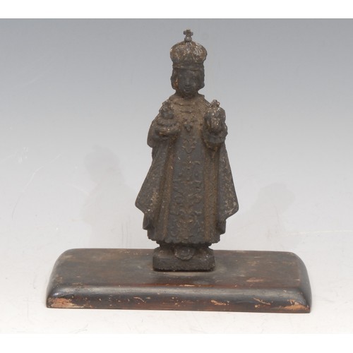 3064 - A cast metal ecclesiastical figure, The Infant Jesus Of Prague, wooden base, 13cm high