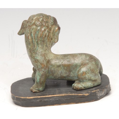 3080 - A Chinese verdigris patinated bronze, of a temple lion, in the Archaic taste, 6cm long