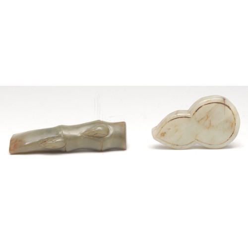 3072 - A Chinese jade toggle, carved as a section of bamboo, 8.5cm long; another (2)