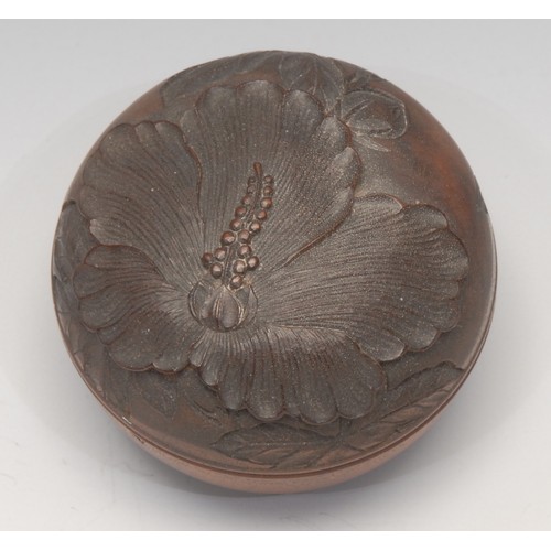 3116 - A Japanese boxwood box and cover, carved with a lotus, signed paper label, 7cm diam,