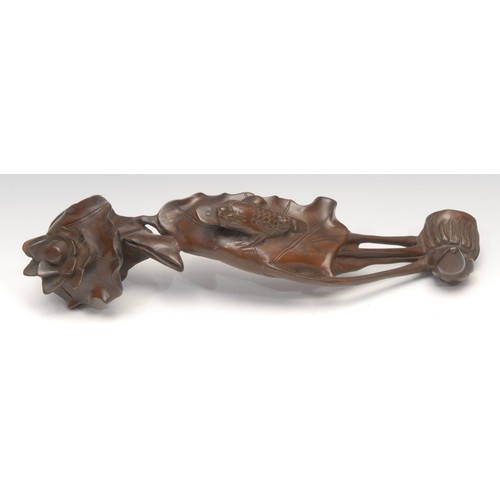 3069 - A Chinese hardwood ruyi, carved as a lotus, the pad with the toad Jin Chan, 37.5cm long