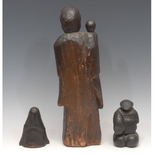 3067 - A Chinese carving, of Buddha and a child, standing, with serene expression, 36.5cm high; others (3)