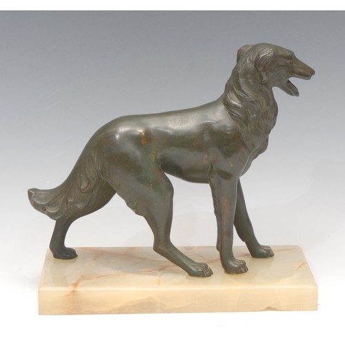 3276 - French Art Deco School, a verdigis patinated spelter model, of a dog, rectangular onyx base, 20.5cm ... 