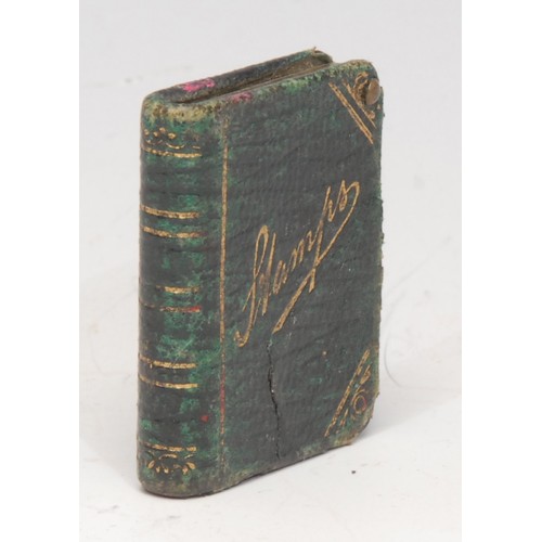 3139 - A late Victorian/Edwardian tooled and gilt morocco leather novelty stamp case, as a book, 3.5cm long... 