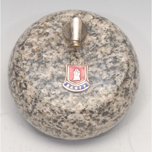 3215 - An early 20th century Scottish granite novelty desk weight, as a curling stone, applied with an enam... 