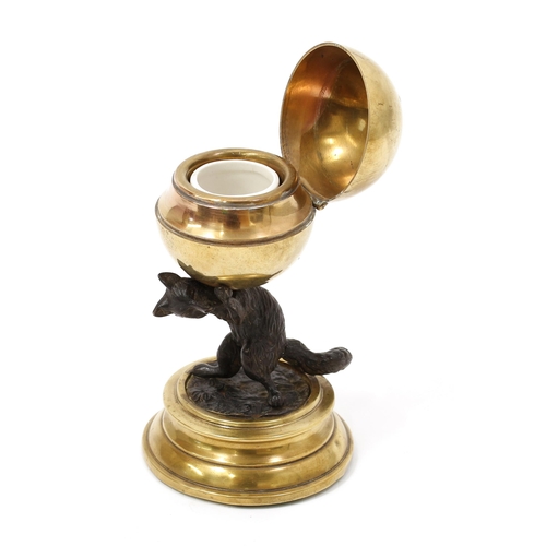 3127 - A late 19th century dark patinated bronze and polished brass novelty inkwell, the globular receptacl... 