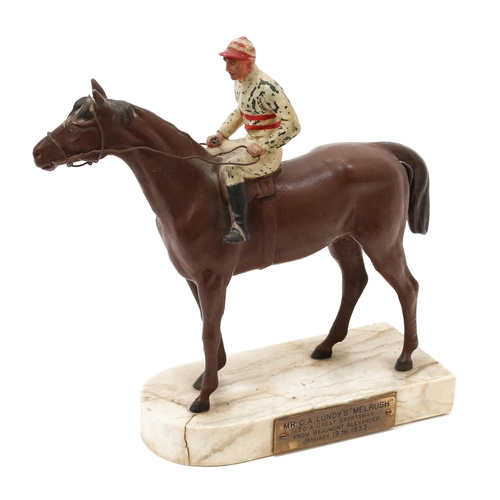 3186 - An Art Deco period painted spelter equestrian model, of a horse and jockey, the marble base with pre... 