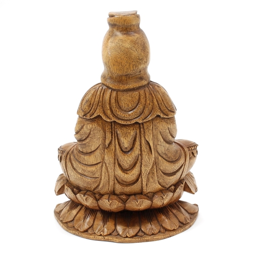 3068 - A Chinese hardwood carving, of Bodhisattva Guanyin, seated in a lotus and holding a bottle, 31cm hig... 